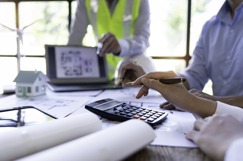 Architecture Engineer Teamwork Meeting, Drawing and working for Architectural projects and engineering tools in the workplace, working ideas on architectural structures.